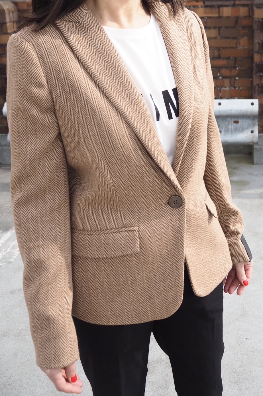 The Camel jacket is longer on the sleeve and not as snug fitting...